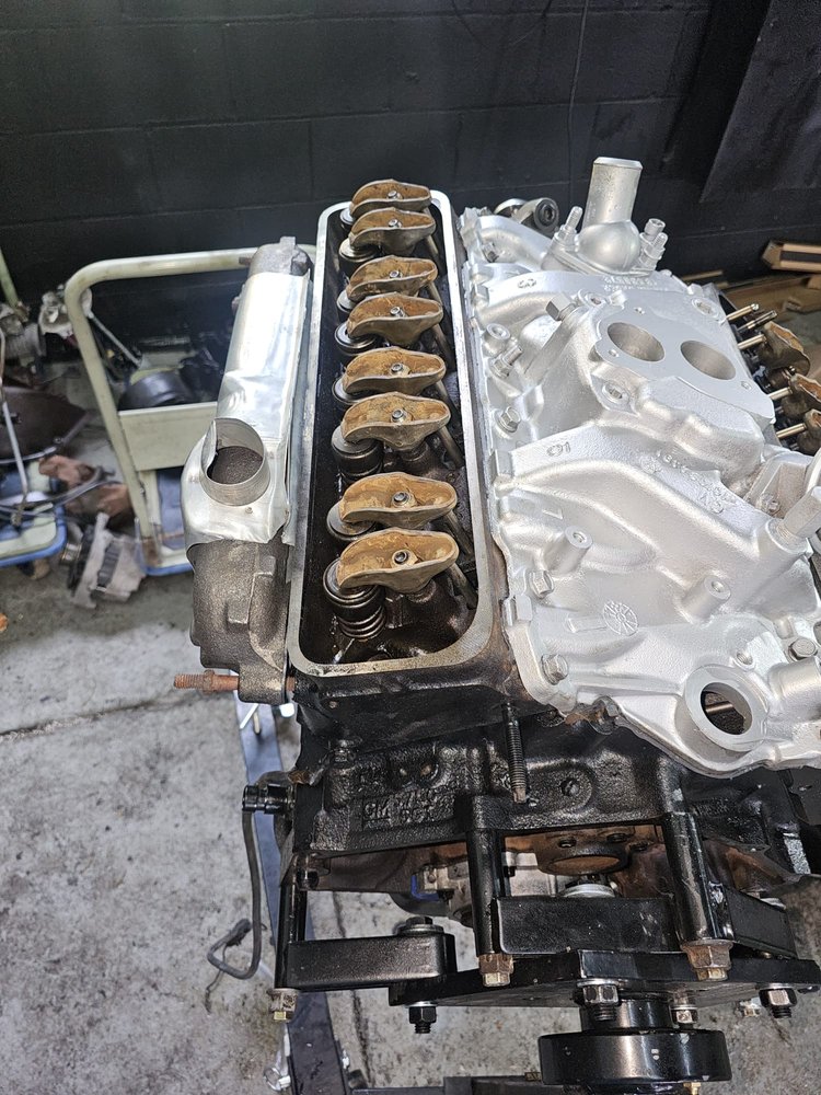 Engine block with new pistons during a rebuild