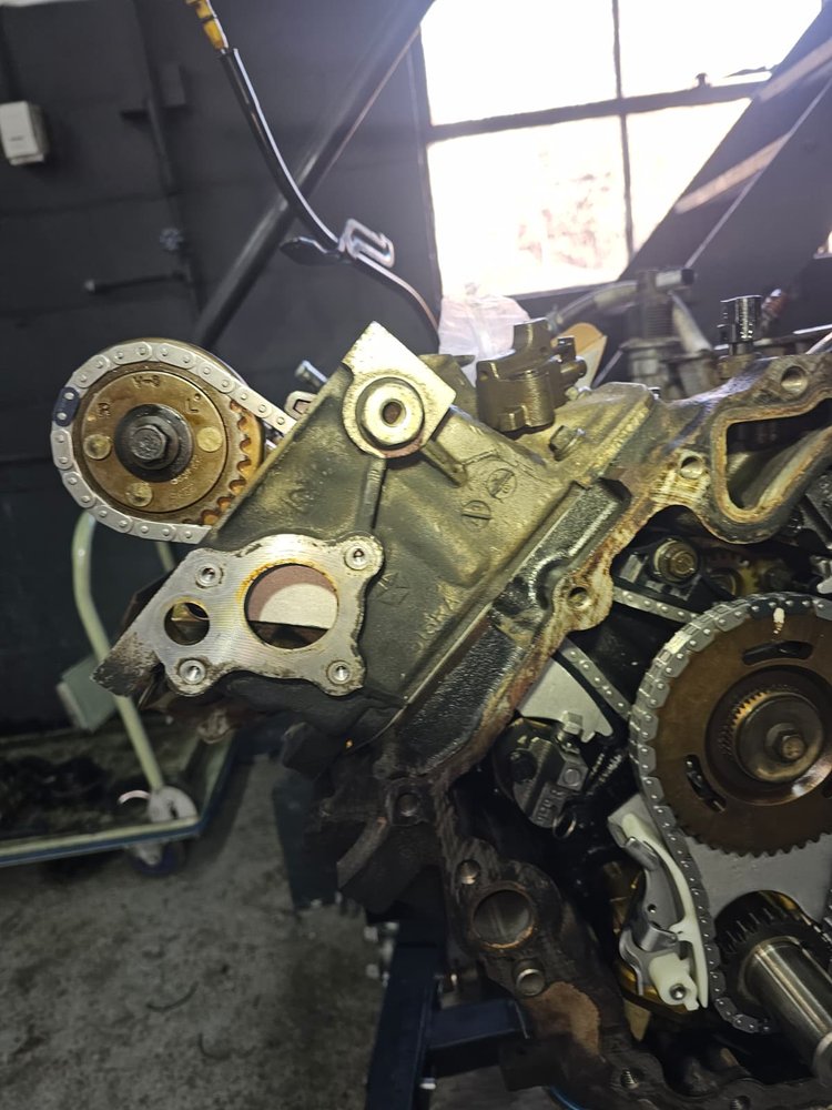 Timing cover and gears on an engine being rebuilt